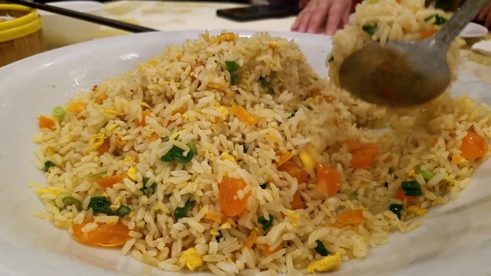 Chinese dishes on white plates.